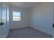 Simple bedroom with carpet and neutral walls at 5725 W Osborn Rd, Phoenix, AZ 85031