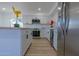 A modern kitchen with white cabinets, stainless steel appliances, and a butcher block island at 5725 W Osborn Rd, Phoenix, AZ 85031