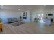 Bright living room with decorative wall and open view into the kitchen and dining areas at 5725 W Osborn Rd, Phoenix, AZ 85031