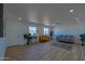 Bright living room featuring hardwood floors, wainscoting, and a cozy seating area at 5725 W Osborn Rd, Phoenix, AZ 85031