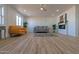 Bright living room with wood floors, a modern fireplace, stylish furniture, and recessed lighting at 5725 W Osborn Rd, Phoenix, AZ 85031