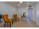 Bright living room with light wood floors and a hallway leading to other rooms at 5725 W Osborn Rd, Phoenix, AZ 85031