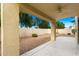 Relaxing covered back patio with neutral post and beams, fan and gravel landscaping at 60 W Beechnut Pl, Chandler, AZ 85248