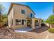 Exterior of home with covered patio and landscaped backyard, perfect for relaxing or entertaining at 60 W Beechnut Pl, Chandler, AZ 85248