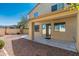 Covered backyard patio extends the living space outdoors, complemented by a low-maintenance landscape at 60 W Beechnut Pl, Chandler, AZ 85248