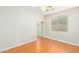 Bedroom featuring hardwood floors, a ceiling fan, a window, and a closet at 60 W Beechnut Pl, Chandler, AZ 85248