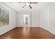 Bright bedroom features hardwood floors and closet at 60 W Beechnut Pl, Chandler, AZ 85248