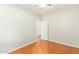 Bright bedroom with warm wood flooring, ceiling fan and a neutral color palette at 60 W Beechnut Pl, Chandler, AZ 85248