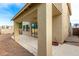 Two-story home featuring a covered patio, textured stucco, gravel landscaping, and dark trimmed windows at 60 W Beechnut Pl, Chandler, AZ 85248