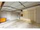 Well-organized garage featuring plentiful white cabinets, peg board, water heater, and overhead door at 60 W Beechnut Pl, Chandler, AZ 85248