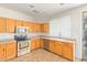 Bright kitchen with stainless steel appliances, and light wood cabinetry at 60 W Beechnut Pl, Chandler, AZ 85248