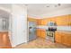 Traditional kitchen with stainless steel appliances and light wood cabinetry at 60 W Beechnut Pl, Chandler, AZ 85248