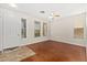 Well-lit living room showcases hardwood floors, ample natural light, and a ceiling fan for added comfort at 60 W Beechnut Pl, Chandler, AZ 85248