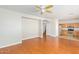 Open floor plan with hardwood flooring, connecting living area to the kitchen at 60 W Beechnut Pl, Chandler, AZ 85248