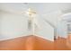 Bright living room featuring wood-look floors, a ceiling fan, and a staircase at 60 W Beechnut Pl, Chandler, AZ 85248