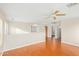 Upstairs living room with hardwood flooring, a ceiling fan, and neutral paint at 60 W Beechnut Pl, Chandler, AZ 85248