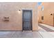 Back door entrance with security door and exterior lighting at 6302 N 64Th Dr # 4, Glendale, AZ 85301