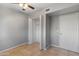 Bedroom with gray walls, tile floors, and a double door closet at 6302 N 64Th Dr # 4, Glendale, AZ 85301