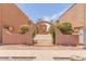 Tan colored buildings with courtyard and arched entryway at 6302 N 64Th Dr # 4, Glendale, AZ 85301