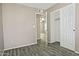 Bedroom with tile floor, closet, and view into another bedroom at 6334 W Vogel Ave, Glendale, AZ 85302