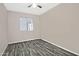 Bright bedroom with tile flooring, ceiling fan and window with view to another room at 6334 W Vogel Ave, Glendale, AZ 85302