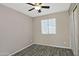 Simple bedroom with tile floor, ceiling fan, and window blinds at 6334 W Vogel Ave, Glendale, AZ 85302