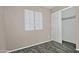 Spacious bedroom with tile flooring, large closet, and window blinds at 6334 W Vogel Ave, Glendale, AZ 85302