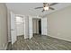 Bedroom with double closets and wood-look tile floor at 6334 W Vogel Ave, Glendale, AZ 85302