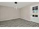 Dining area with wood-look tile floors and pendant lighting at 6334 W Vogel Ave, Glendale, AZ 85302