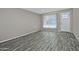 Living room with wood-look tile floor and front door at 6334 W Vogel Ave, Glendale, AZ 85302