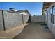 Side yard with gravel, block wall, and gated access at 6334 W Vogel Ave, Glendale, AZ 85302