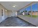 Bright sunroom with tile flooring, ceiling fan, and view of backyard at 6334 W Vogel Ave, Glendale, AZ 85302