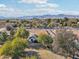 Aerial view of a house with a large backyard, mountain views, and surrounding landscape at 6611 N 181St Ave, Waddell, AZ 85355