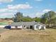 Aerial view of single story home with large yard and mountain views at 6611 N 181St Ave, Waddell, AZ 85355