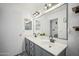 Modern bathroom with dual vanity, updated fixtures and a large mirror at 6611 N 181St Ave, Waddell, AZ 85355