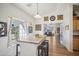 Kitchen with breakfast bar and view to the living room at 6611 N 181St Ave, Waddell, AZ 85355