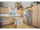 Well-equipped kitchen featuring stainless steel appliances and wood cabinets at 6611 N 181St Ave, Waddell, AZ 85355