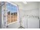 Bright laundry room with washer, dryer, and ample storage at 6611 N 181St Ave, Waddell, AZ 85355