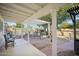 Relaxing patio with pergola, seating area, and brick flooring at 6611 N 181St Ave, Waddell, AZ 85355