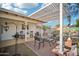 Charming patio area with pergola, seating area, and brick flooring at 6611 N 181St Ave, Waddell, AZ 85355