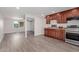 Updated kitchen featuring wood cabinets and stainless steel appliances at 6936 W Berkeley Rd, Phoenix, AZ 85035