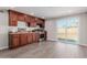 Modern kitchen with dark wood cabinets and stainless steel appliances at 6936 W Berkeley Rd, Phoenix, AZ 85035