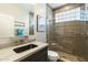 Modern bathroom with glass shower and stylish sink at 6963 E Bramble Berry Ln, Scottsdale, AZ 85266