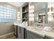 Elegant bathroom with double vanity and quartz countertops at 6963 E Bramble Berry Ln, Scottsdale, AZ 85266