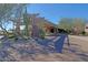 Modern community entrance with covered walkway and desert landscaping at 6963 E Bramble Berry Ln, Scottsdale, AZ 85266