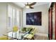 Modern dining area with glass table and seating for four at 6963 E Bramble Berry Ln, Scottsdale, AZ 85266