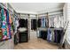 Large walk-in closet with ample hanging space and shelving at 6963 E Bramble Berry Ln, Scottsdale, AZ 85266