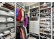 Custom-designed walk-in closet with shelving and drawers at 6963 E Bramble Berry Ln, Scottsdale, AZ 85266