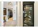 Walk-in wine and beverage cooler, conveniently located near the entryway at 6963 E Bramble Berry Ln, Scottsdale, AZ 85266