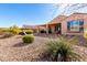 Landscaped backyard with gravel and a lounge chair at 8088 W Cinder Brook Way, Florence, AZ 85132